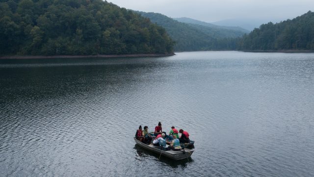 Students on boats over Switzer Lake