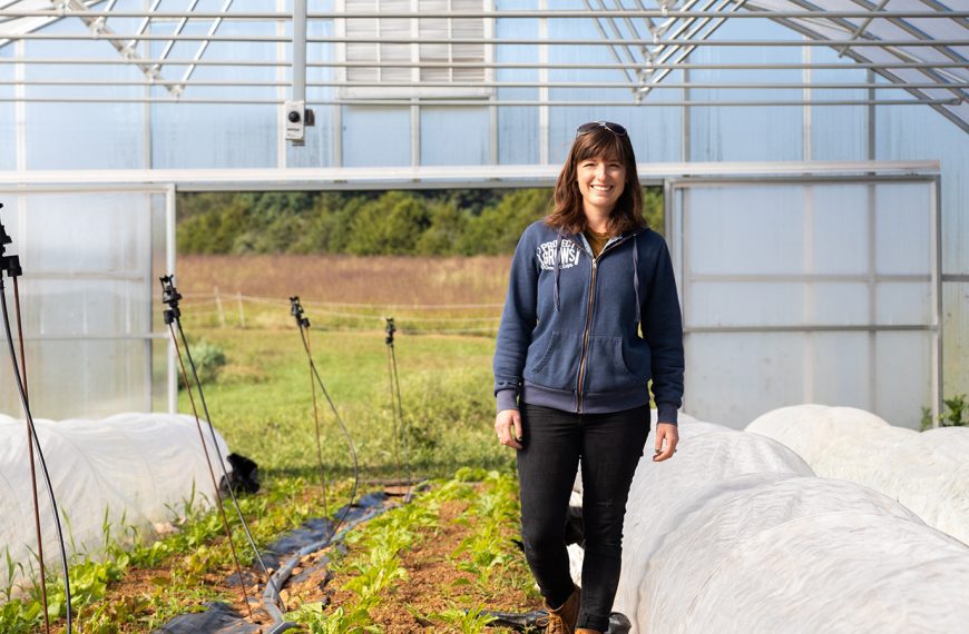 Clara Metzler walking in a greenhouse