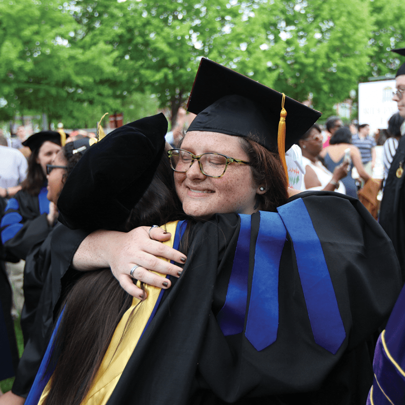 Two people embracing during Commencement 2019