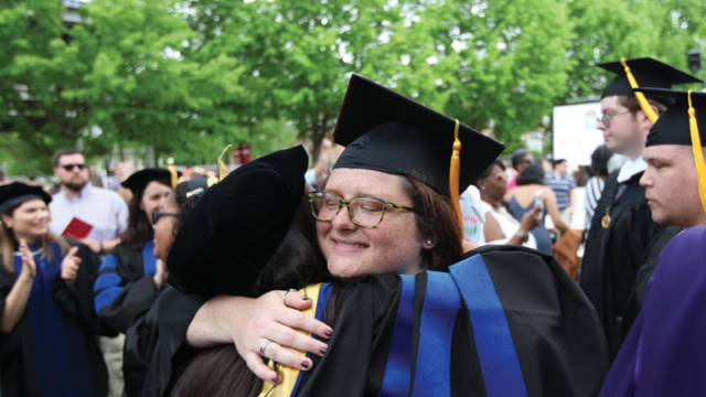 Two people embracing during Commencement 2019