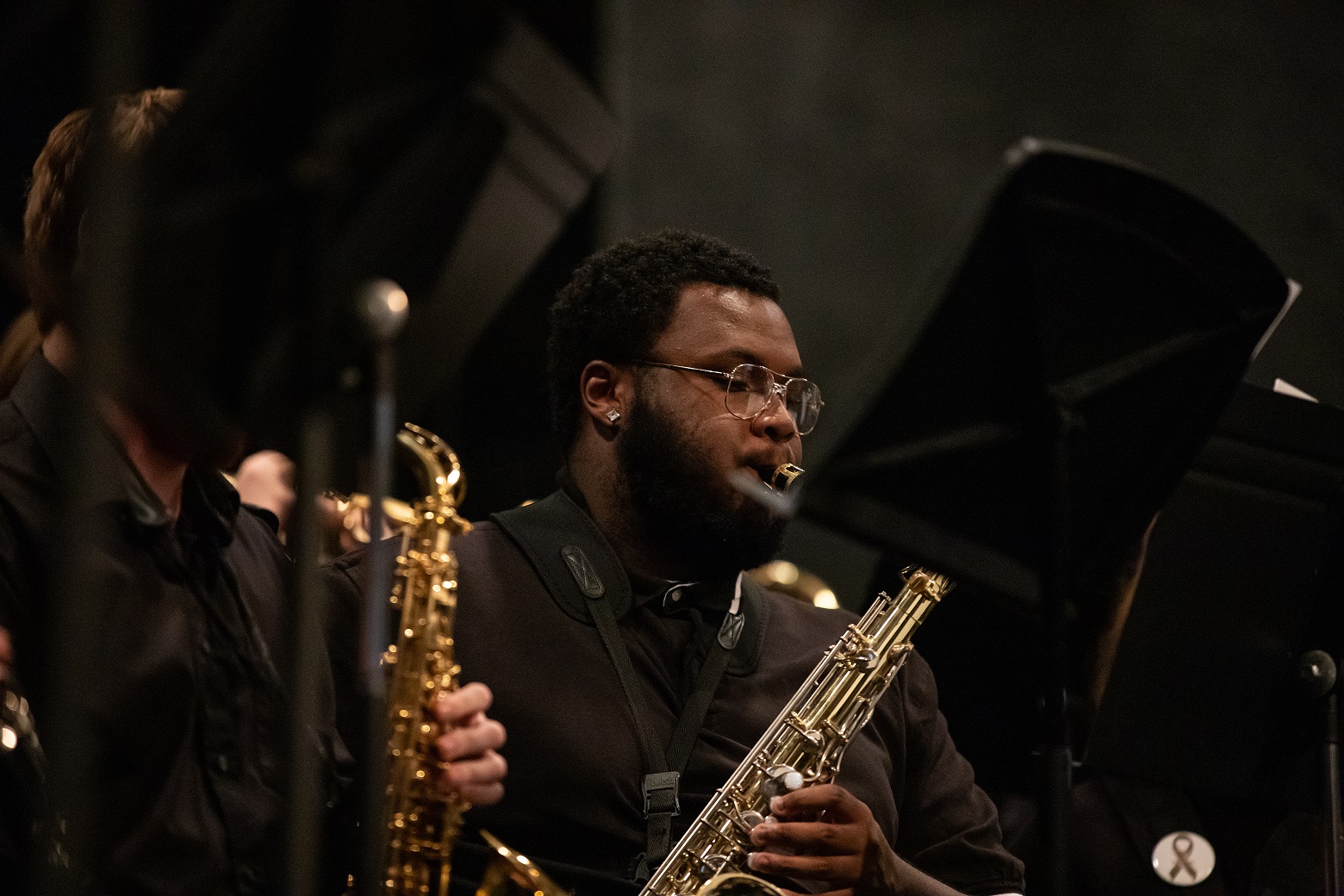 A male student plays a wind instrument.