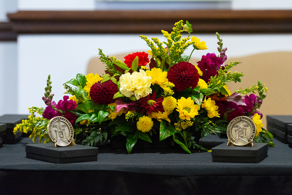 Flower arrangement with Ripples Society coins