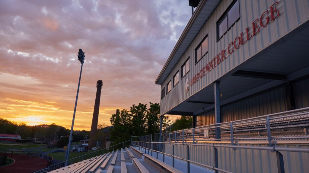 Zoom background of Bridgewater College Jopson athletic complex stands at sunset