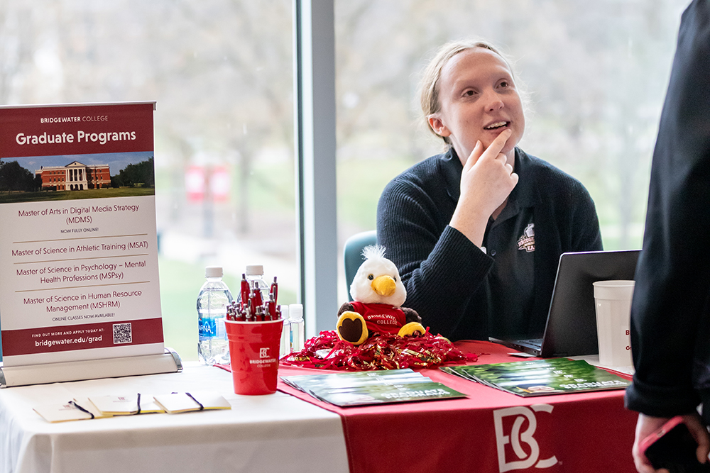 Tori Hudson sitting at a graduate program table