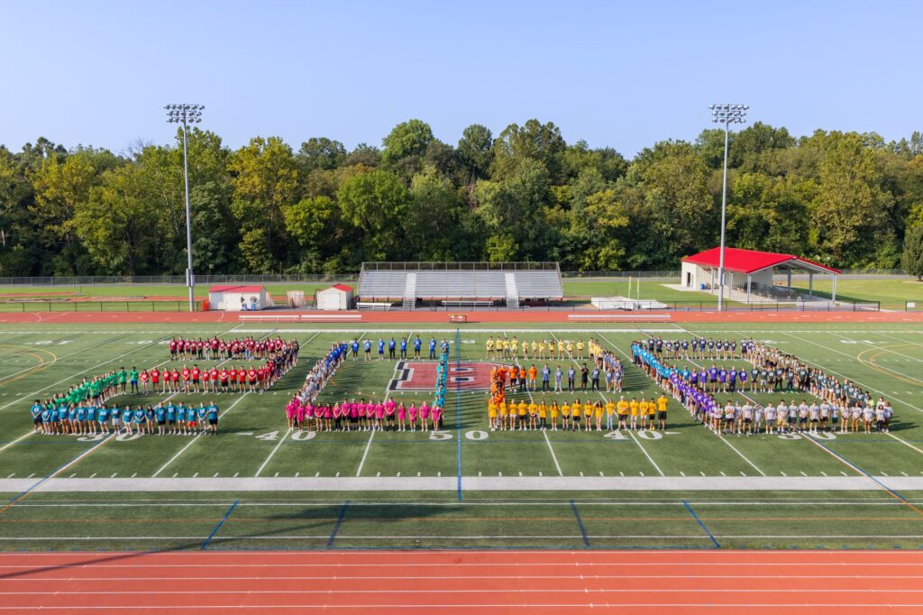 Class of 2028 on football field.