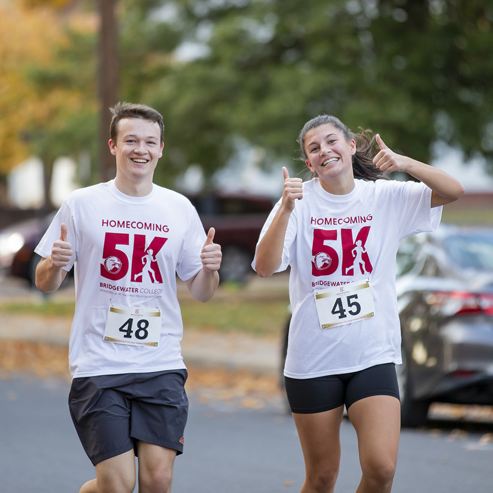 Participants in the 5-K giving thumbs up