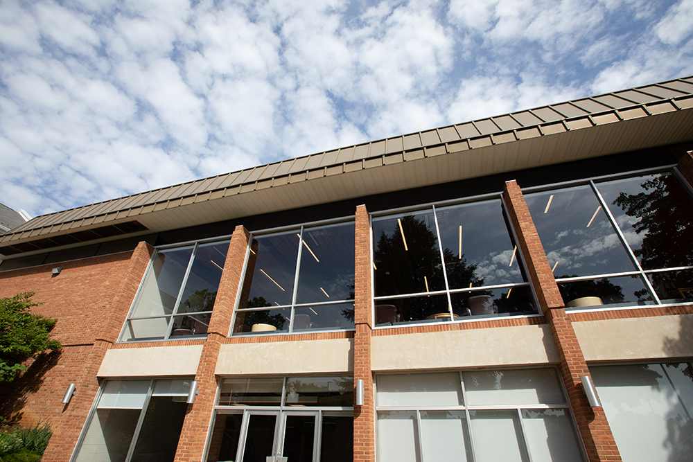 Windows and puffy clouds outside the Kline Campus Center