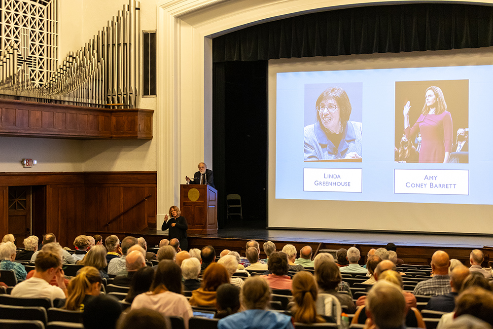 Dr. David Hollinger giving a presentation in front of a crowd in Cole Hall