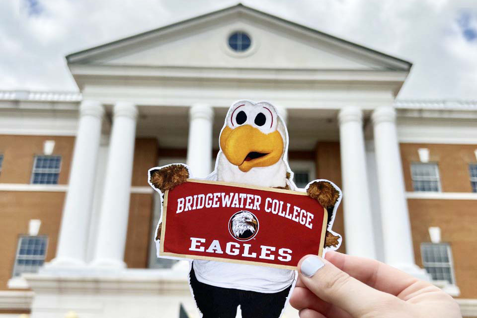 Flat Ernie being held in front of McKinney Center