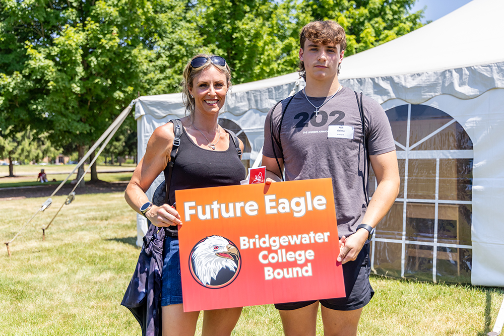 Mother and son holding sign that reads Future Eagle Bridgewater College Bound