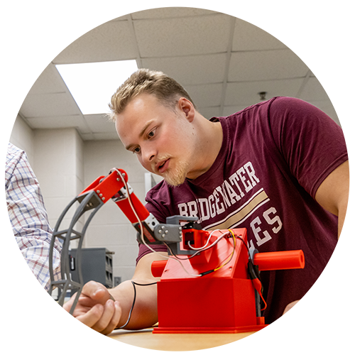 Engineering student working with a peice of equipment