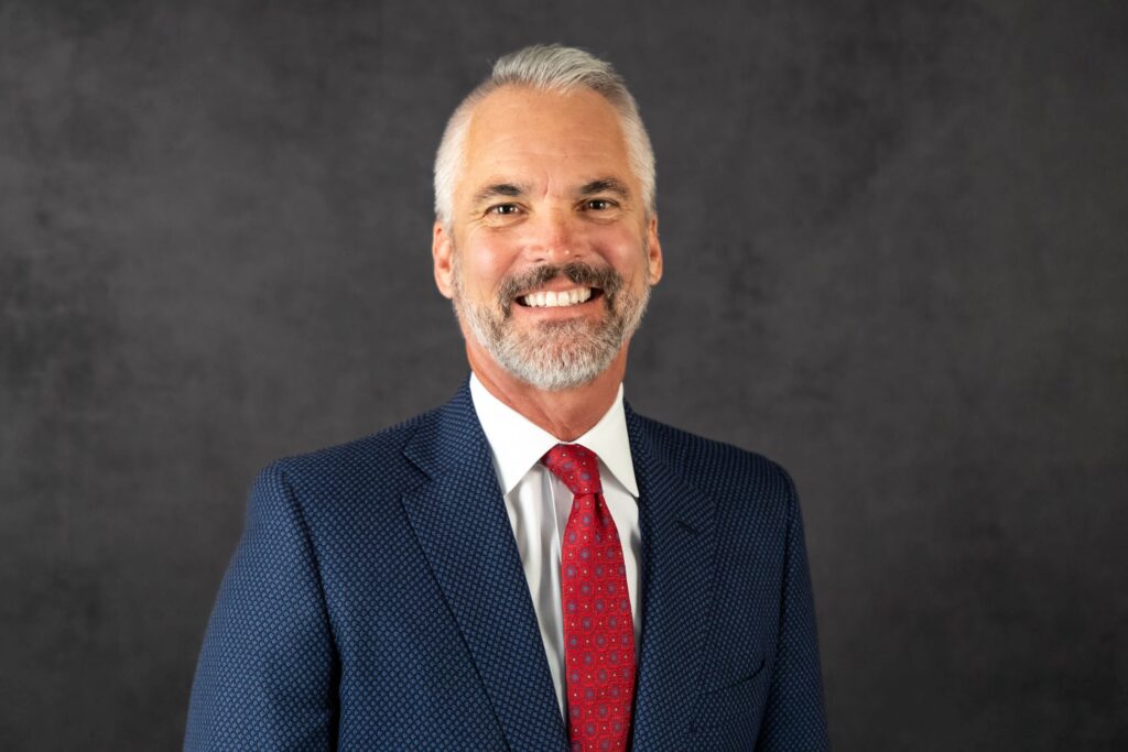 Portrait of Dr. David Bushman beaming