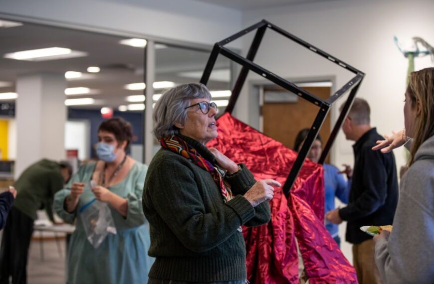 Professor Nan Covert at an art gallery opening.