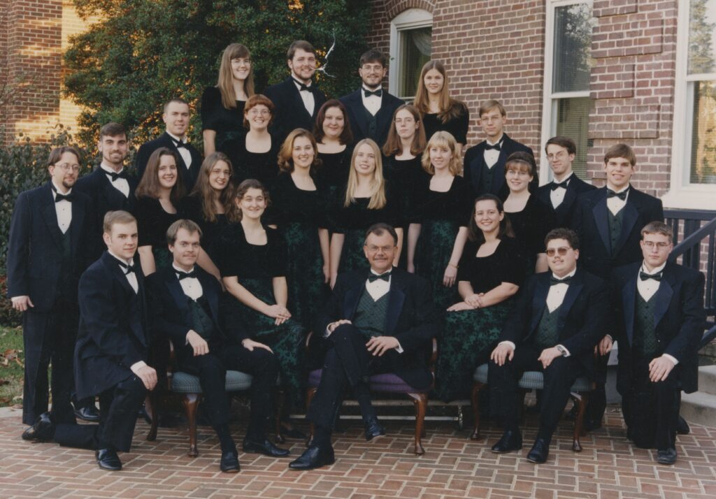 Jesse Hopkins surrounded by students