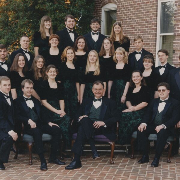 Jesse Hopkins surrounded by students