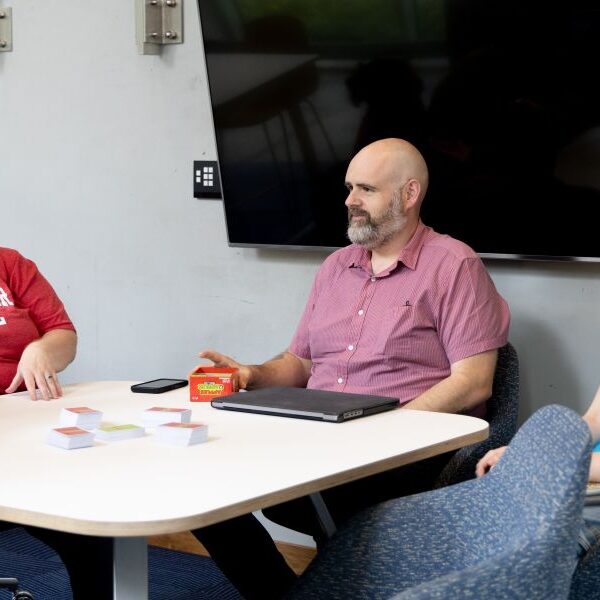 Student and professor playing Apples to Apples