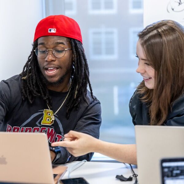 Two students with computer