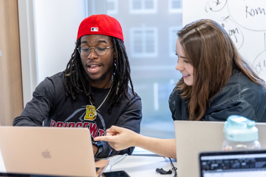 Two students with computer